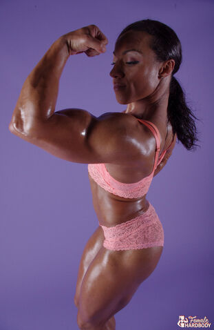 Ebony bodybuilder Karen Garrett demonstrates her muscular