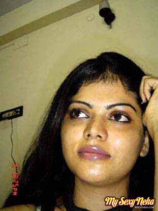 Indian gal Neha takes self shots while she holds her face