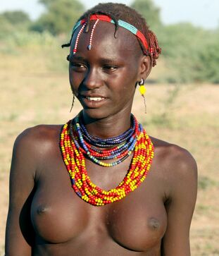 Bare dark-hued tribal gals and one dark-hued sweetheart with