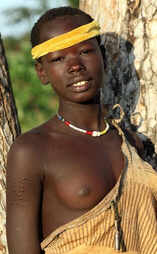 Naked tribe women, dark-hued african chicks sans brassiere