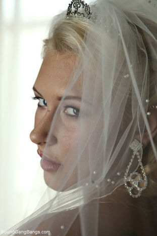 Platinum-blonde bride Katie Summers doffs her wedding