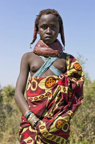 These damsel nude African Aboriginal posing bare-chested