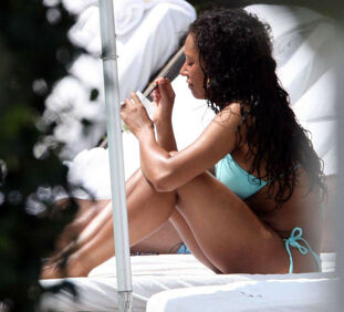 Mel B lovin on pool and demonstrating yam-sized melons and..