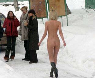Luscious blondie posing naked outdoor in the public place,