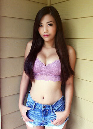 Stunning Chinese light-haired in crimson t-shirt and teensy