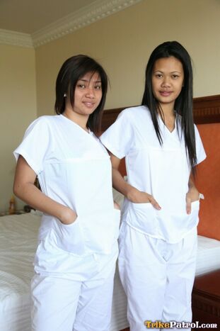 Lusty filipina nurses Joanna and Fun posture on the couch in
