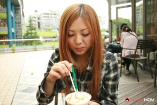 Chinese red-haired Anna Morisaki gargles on a swallow while