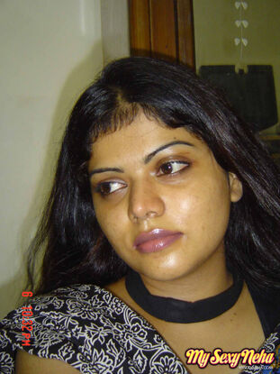 Indian female Neha takes self shots while she holds her face